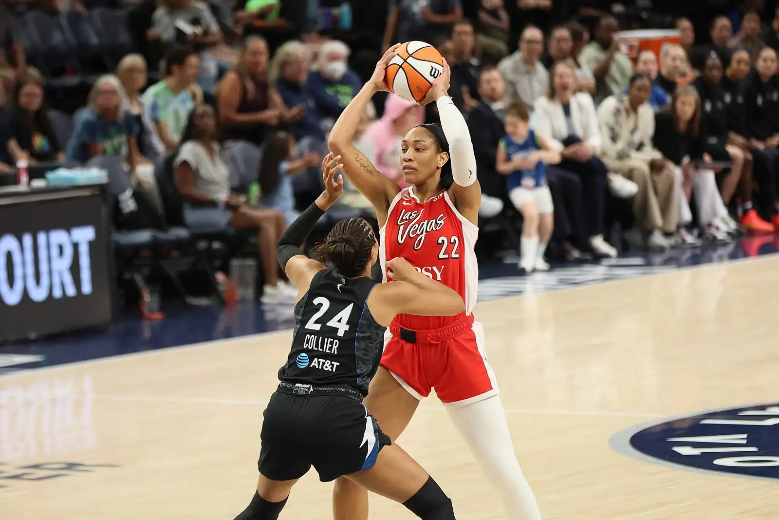 A'ja Wilson of the Las Vegas Aces shooting over a Minnesota Lynx defender