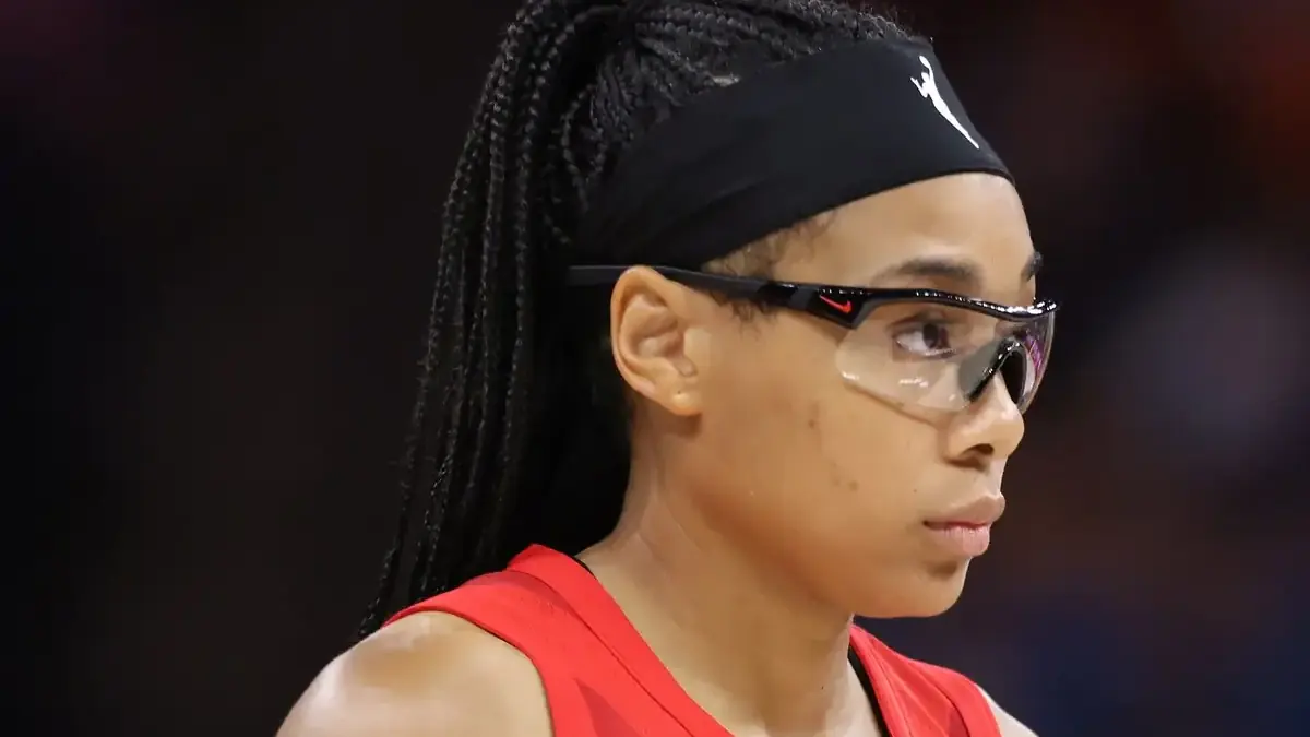 Allisha Gray of the Atlanta Dream in a white jersey holding a basketball