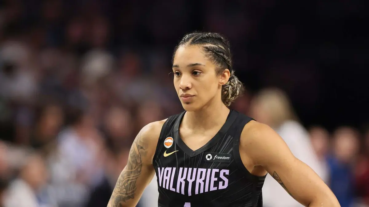 Gabby Williams of the Golden State Valkyries, hands on hips, in a black Valkyries No. 1 jersey