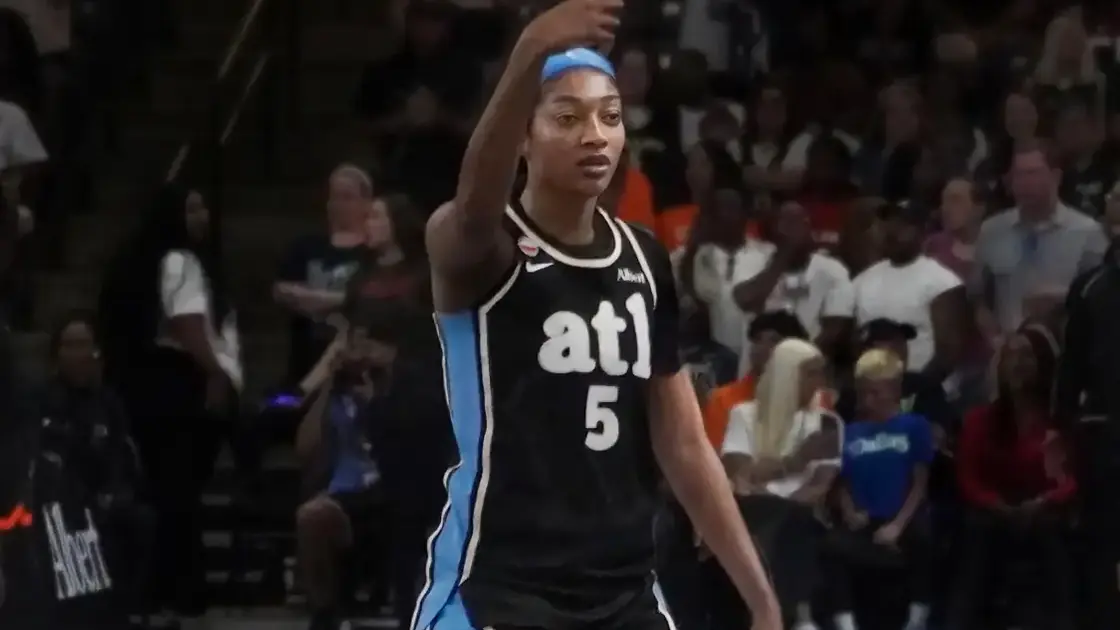 Angel Reese of the Atlanta Dream in a white jersey, number 5, looking to her right at Gateway Center Arena