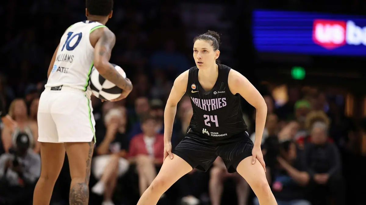Cecilia Zandalasini of the Golden State Valkyries in a black number 24 jersey, in a defensive stance