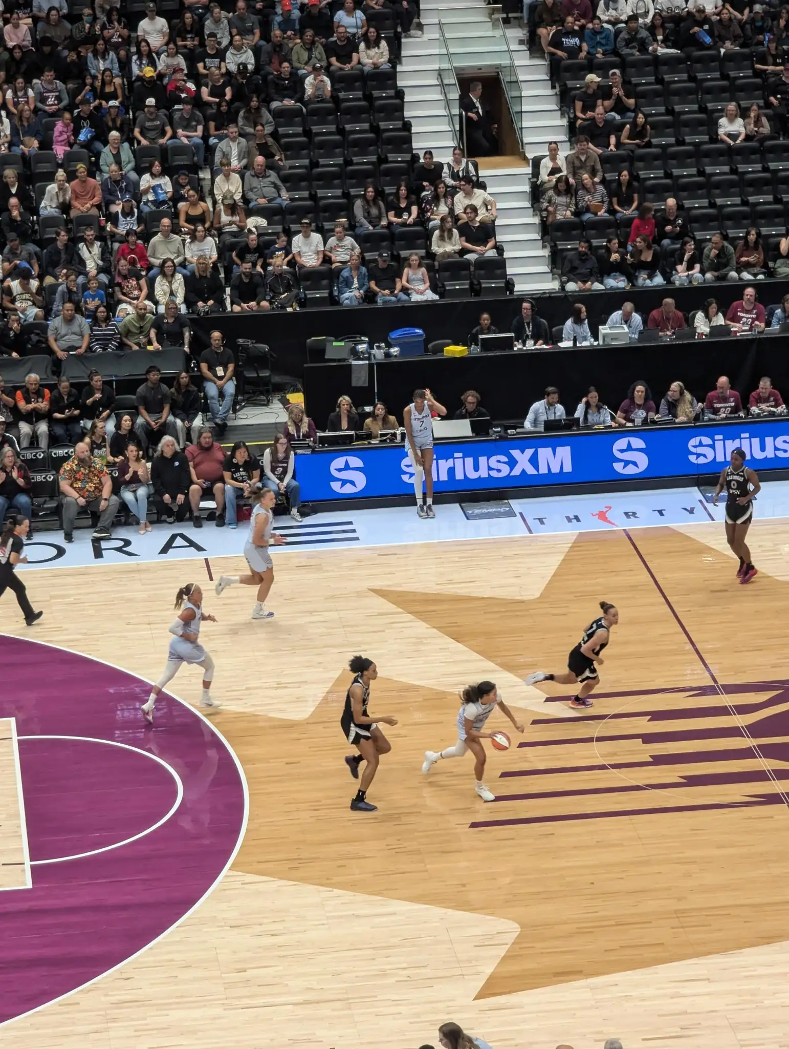 Toronto Tempo players on court against the Las Vegas Aces in Vancouver