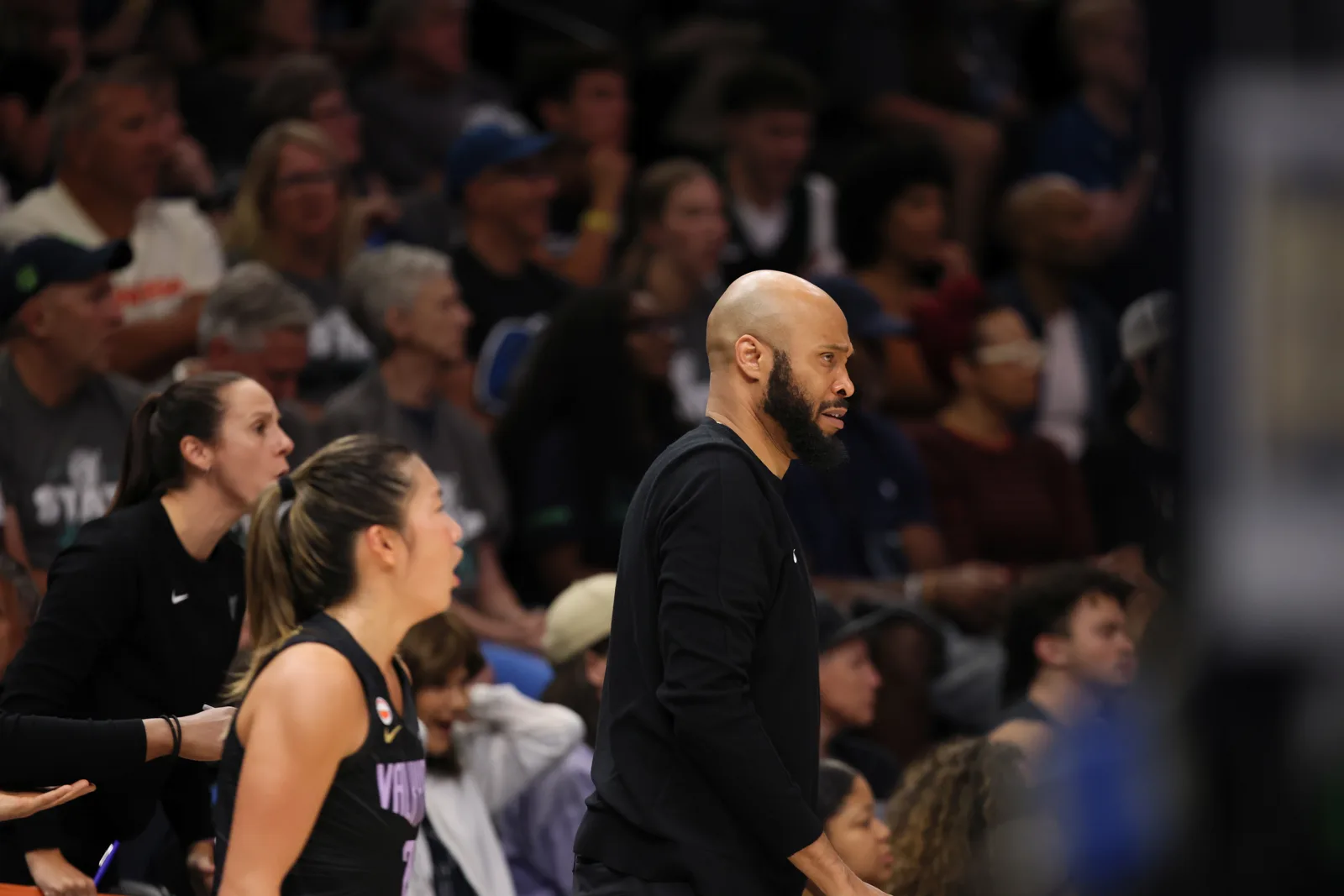 Golden State Valkyries players and staff on the bench during a road game at Target Center in Minneapolis, Aug. 24, 2026