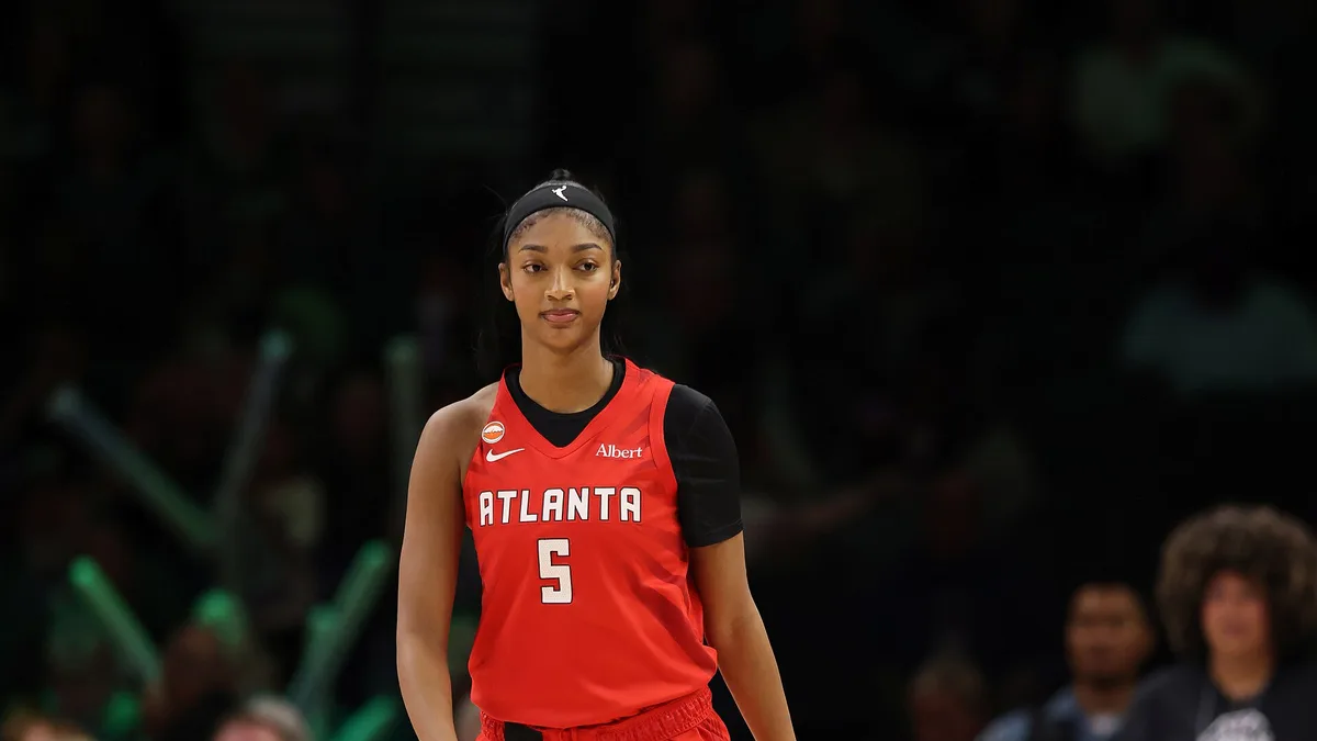 Angel Reese of the Atlanta Dream in a red number 5 Atlanta jersey on the court at Target Center
